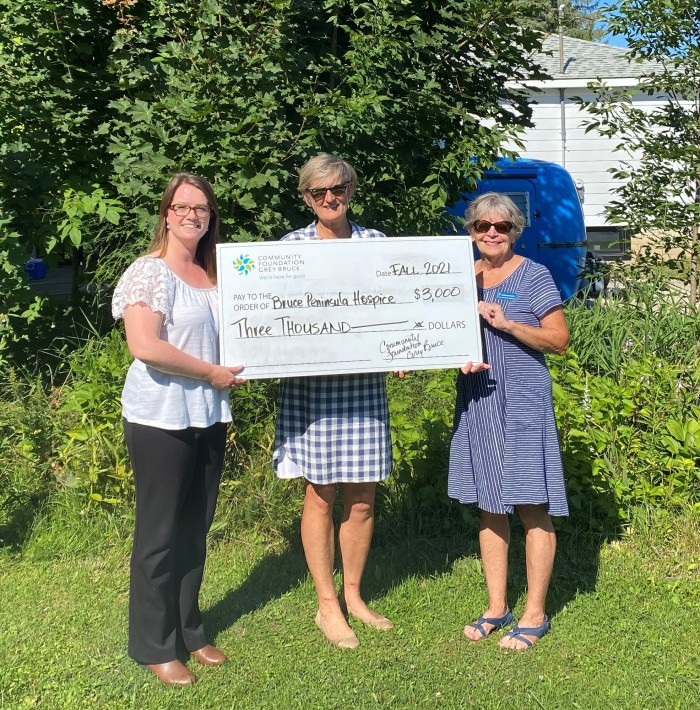 Christine presenting a check to the Bruce Peninsula Hospice