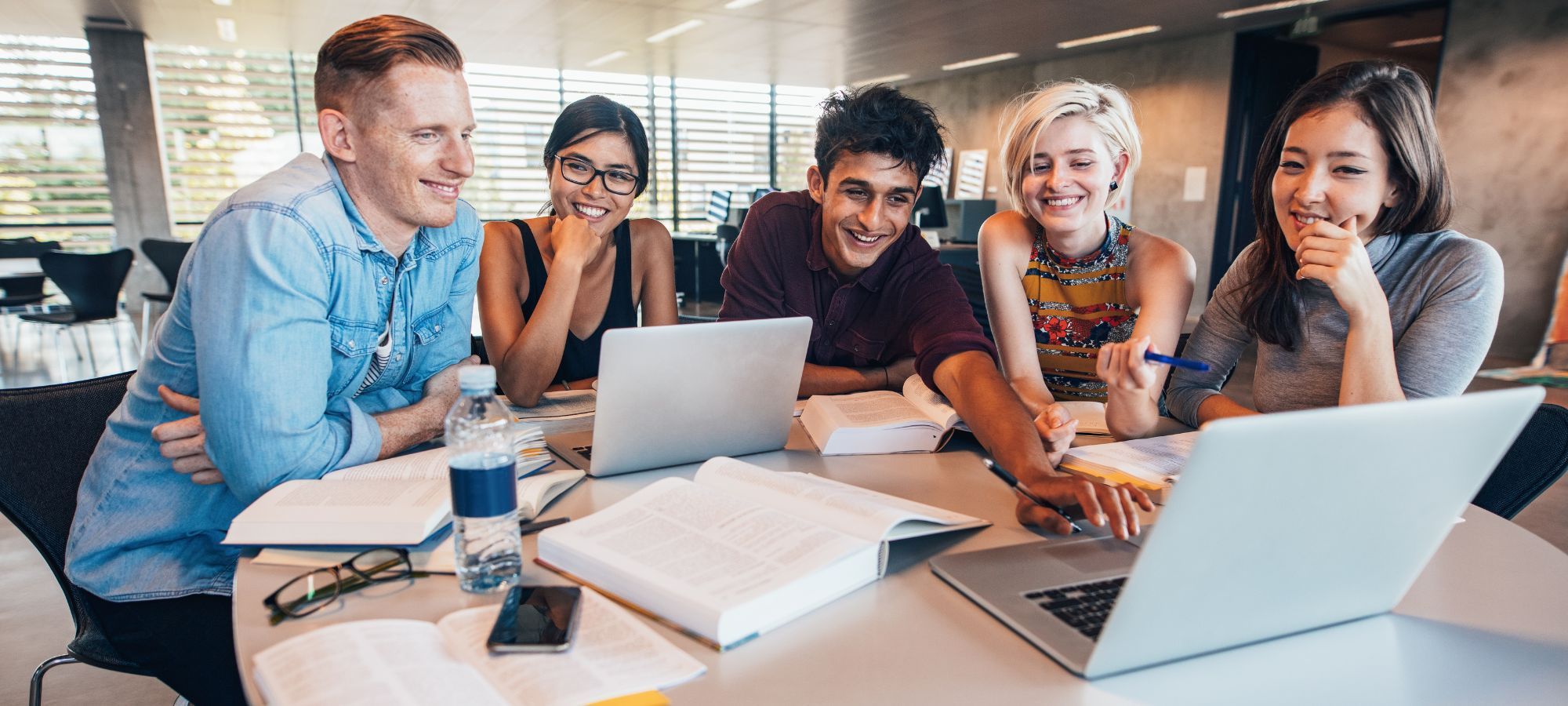 Students use laptop to search for scholarships. 